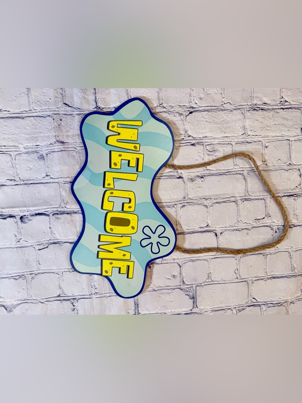 SpongeBob SquarePants-themed "Welcome" hanging sign